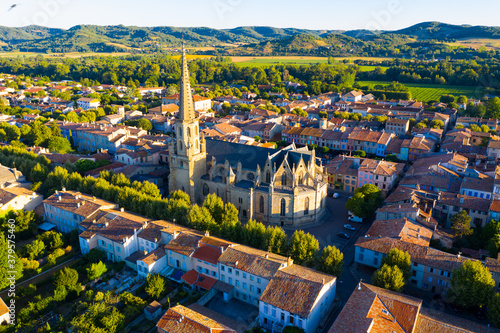 Scenic aerial view of French commune of Mirepoix in green valley at sunny summer day