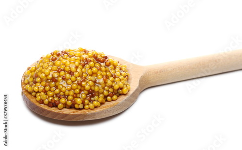 French pickled mustard seeds sauce with seeds in wooden spoon isolated on white background