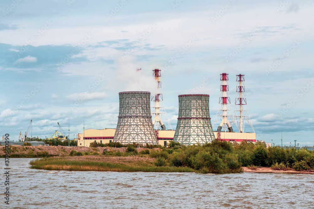 Fototapeta premium Chimneys of a power plant, an industrial district in the South-West of Saint Petersburg