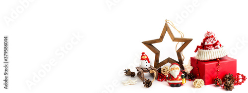 Red gift box, wooden star, Christstmas toys and bumps isolated on white background with copy space. Zero waste new year decor. Reusable Christmas designed banner. Eco-friendly holidays