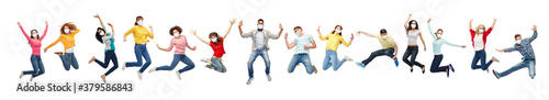 health and pandemic concept - people wearing face protective medical masks for protection from virus disease jumping in air over white background