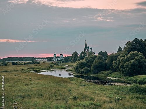 church by the river. summer landscape in the village