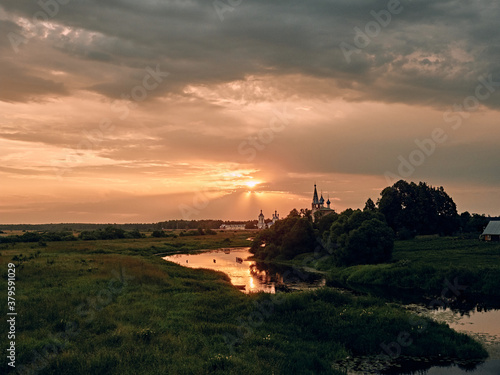 church by the river. rural landscape.