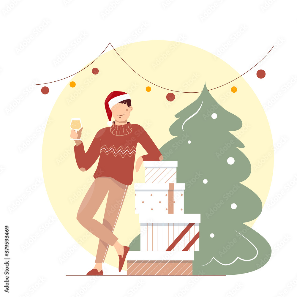 A cute funny young man in the sweater and Santa hat with wineglass celebrating Christmas. A guy near boxes of gifts under garland. A boy with drink near christmas tree. A cute funny young man in the sweater and Santa hat with wineglass celebrating Christmas. A guy near boxes of gifts under garland. A boy with drink near christmas tree.