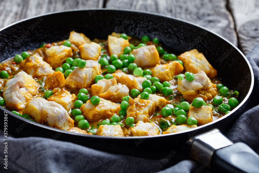fish curry with green peas, top view fish curry with green peas, top view