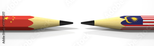 Photography Opposing pencils with flags of China and Malaysia