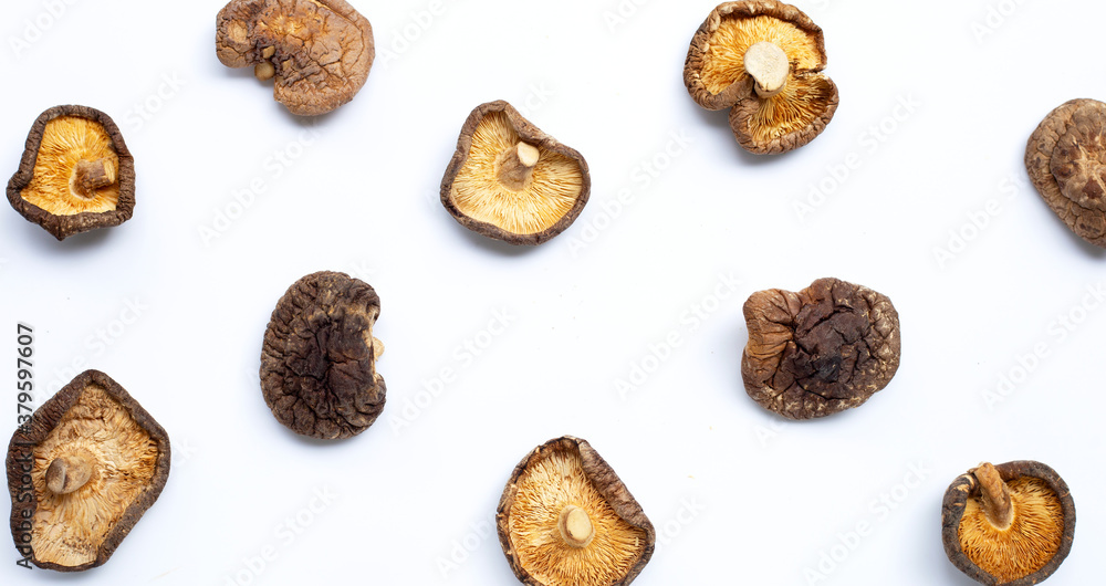 Dried shiitake mushrooms on white background. Dried shiitake mushrooms on white background.
