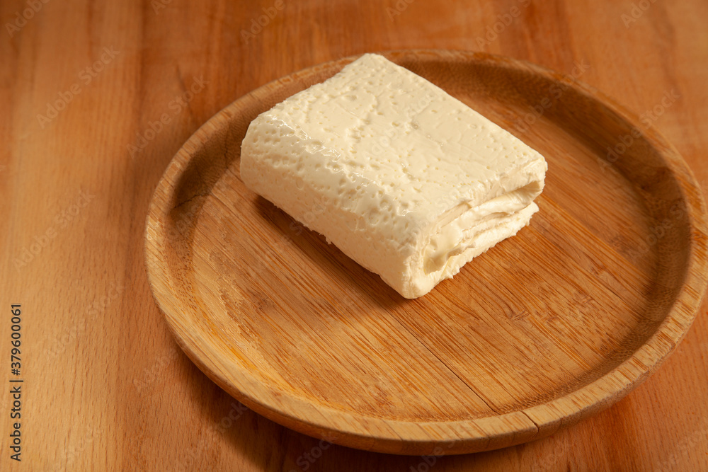  feta cheese in bamboo plate