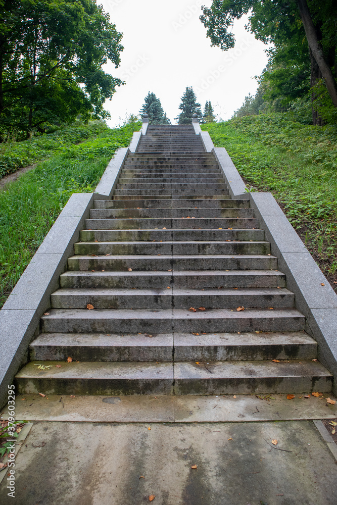 Photo of a long granite staircase in the park Photo of a long granite staircase in the park