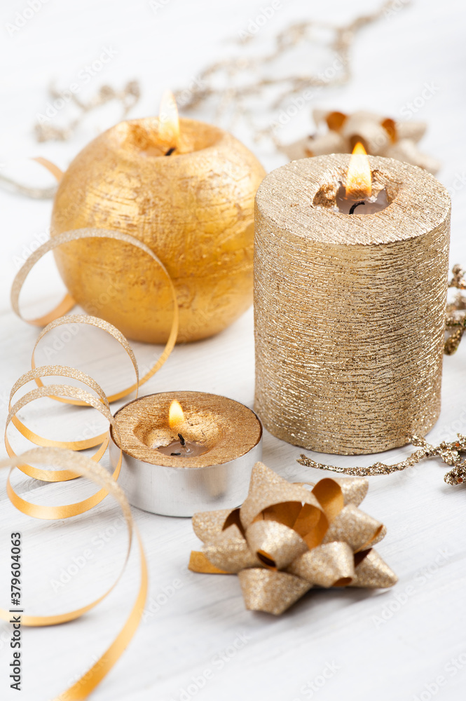 Golden lit aroma candles and Christmas toys