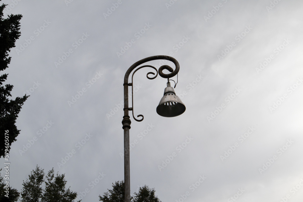 Summer picture of a street fan against the gray sky Summer picture of a street fan against the gray sky