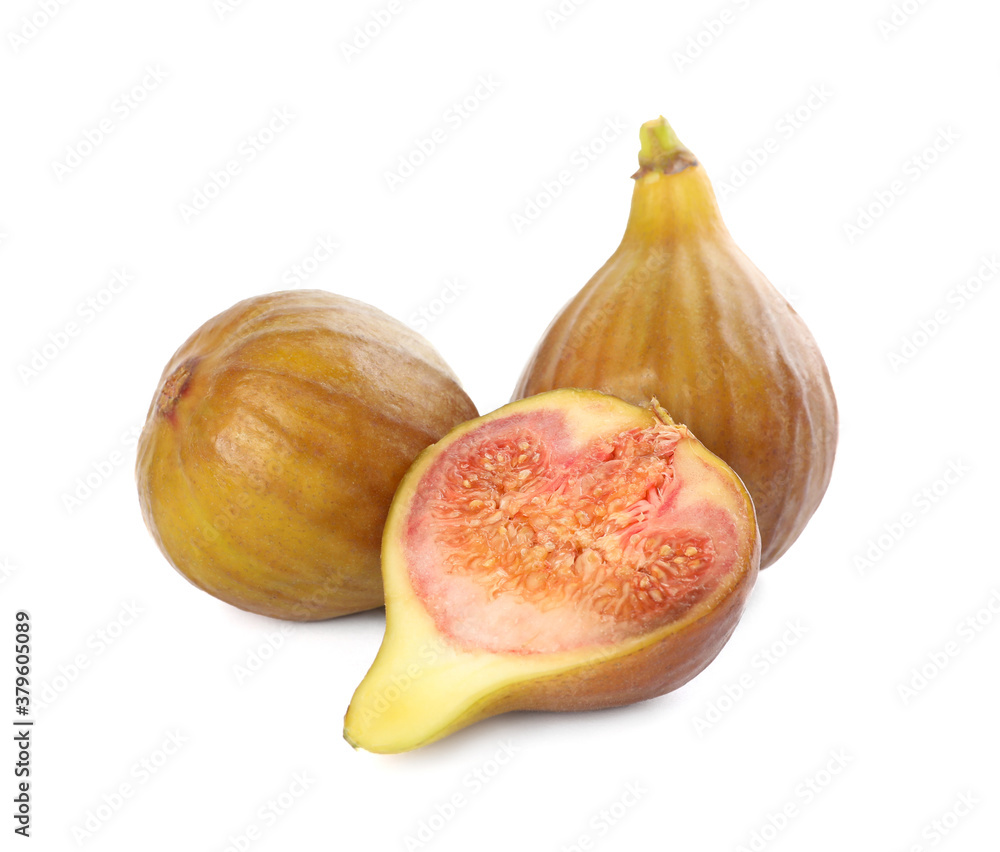 Whole and cut tasty figs isolated on white Whole and cut tasty figs isolated on white