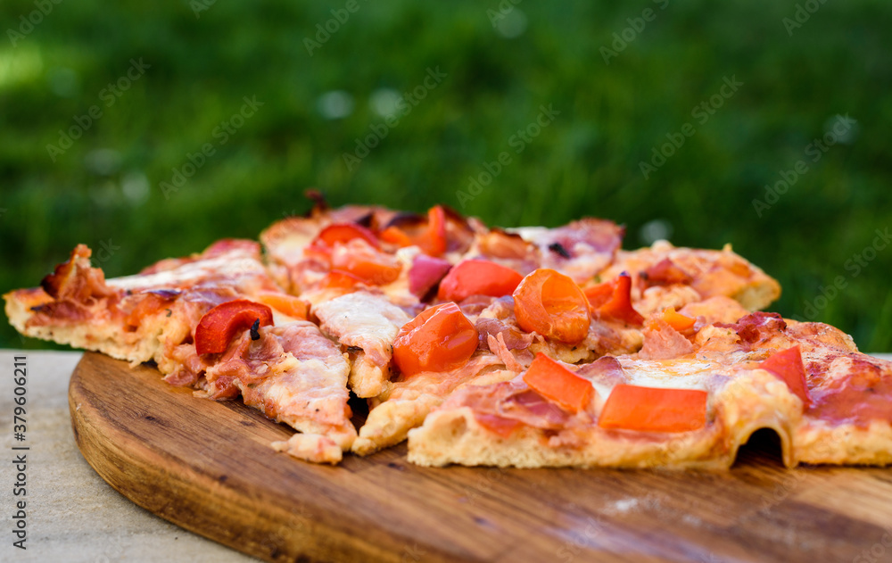 Making of homemade Italian pizza in fireplace brick oven.