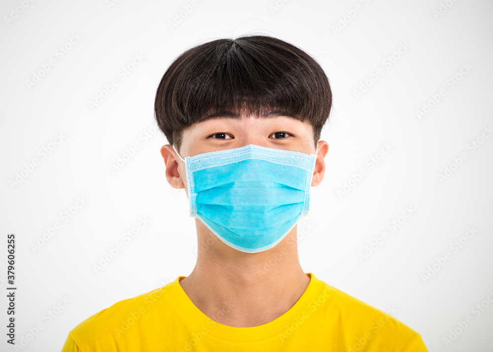 Close up portrait of  teenage Asian boy wear medical mask