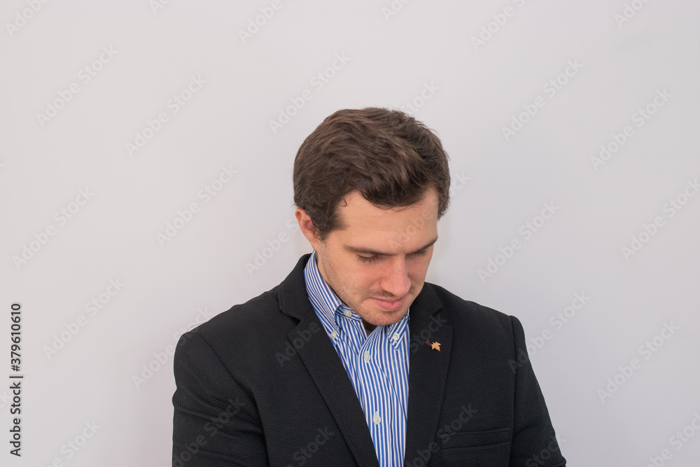Photo of a young and attractive man wearing a suit looking very professional with a white background. Business man, corporative Photo of a young and attractive man wearing a suit looking very professional with a white background. Business man, corporative