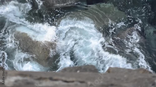 Wallpaper Mural Movement of the sea hitting a wall with breakwater stones Torontodigital.ca