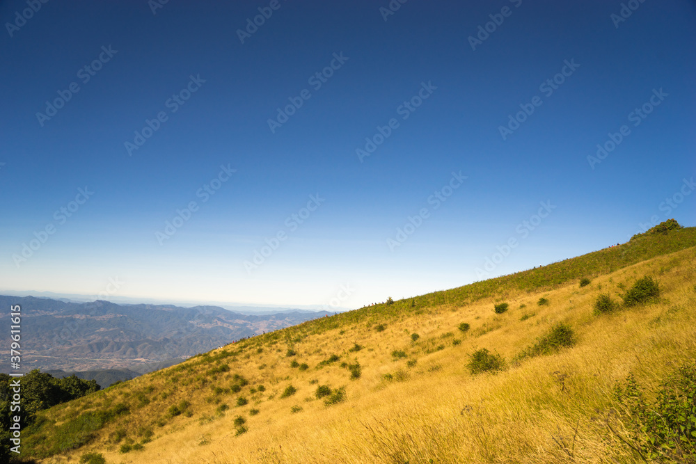Mountain landscape with blue sky.
