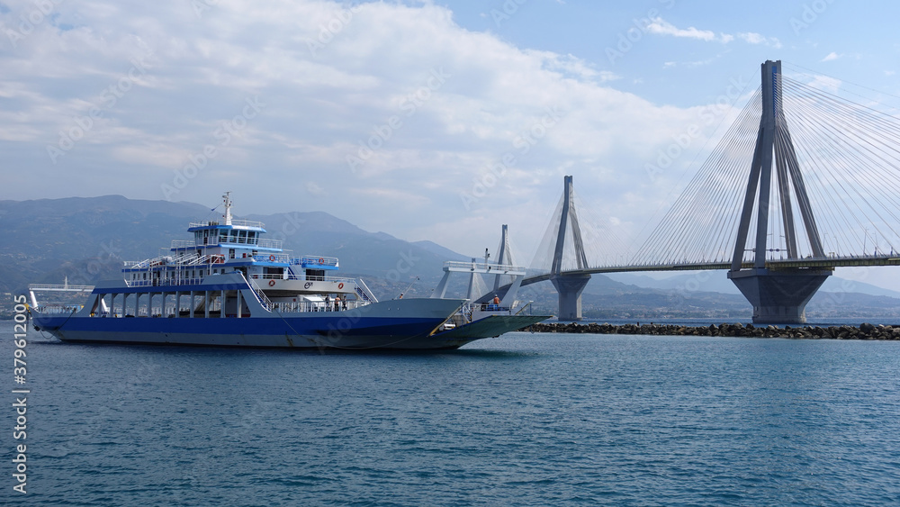 Famous Rio Antirio suspension cable bridge as seen from boat crossing Corinthian gulf, Greece