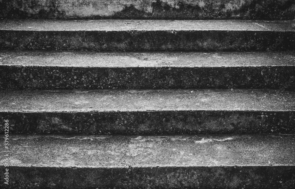 the old and rough surface of the concrete stairway to step up. abstract black and white background. the old and rough surface of the concrete stairway to step up. abstract black and white background.