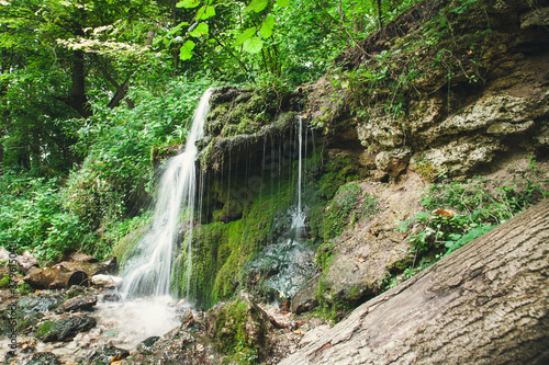 Waterfall in the summer forest. Eco trail in Pushchino on the Oka. Moscow region