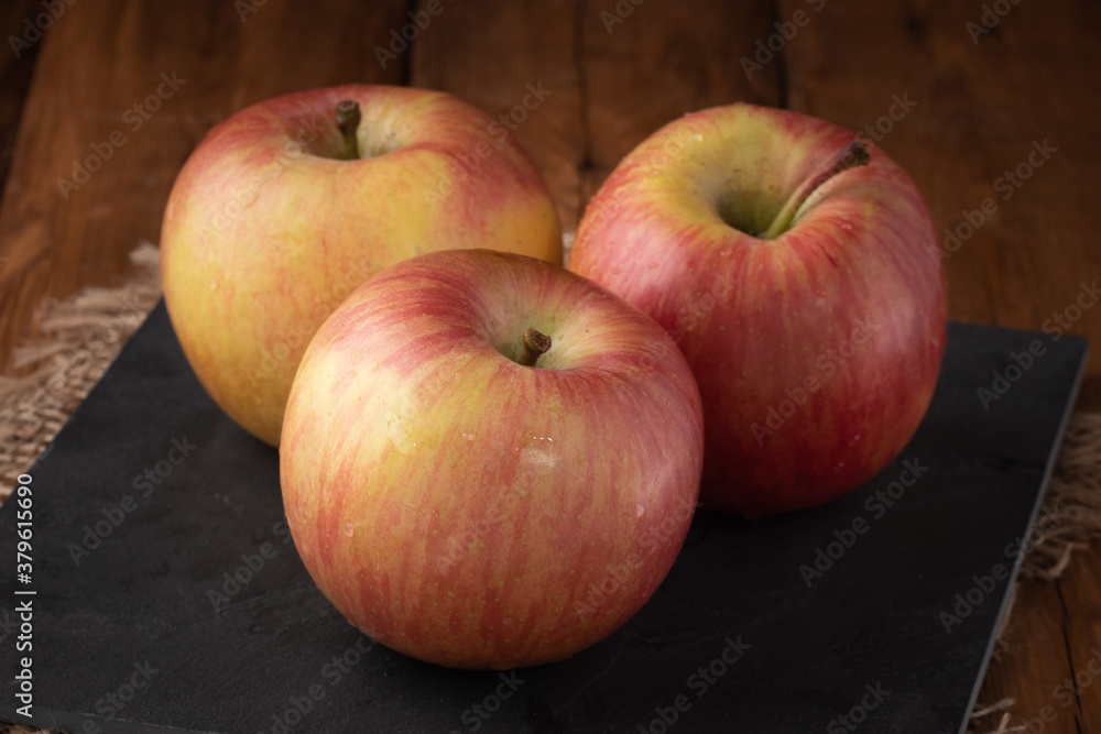 Eco fruits - fresh red apples on wooden background, vegan food Eco fruits - fresh red apples on wooden background, vegan food