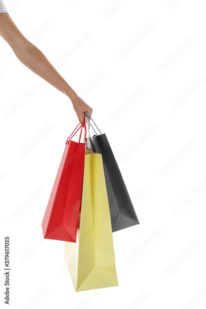 Woman with paper shopping bags on white background, closeup