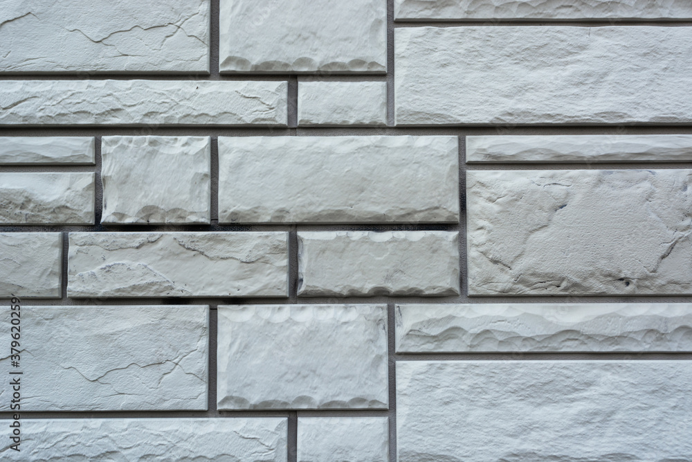 Naklejka premium texture of mosaic brickwork of different sizes and shapes