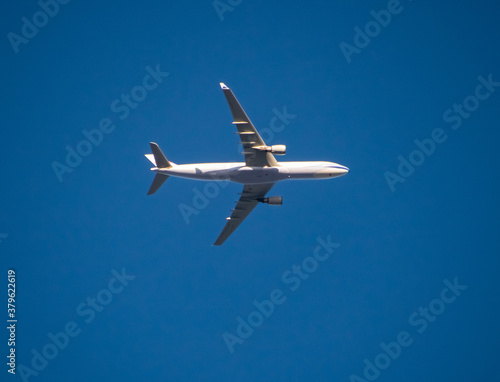 Aeroplane flying high above Sydney Harbour Australia