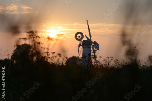 Sunset by a windmill