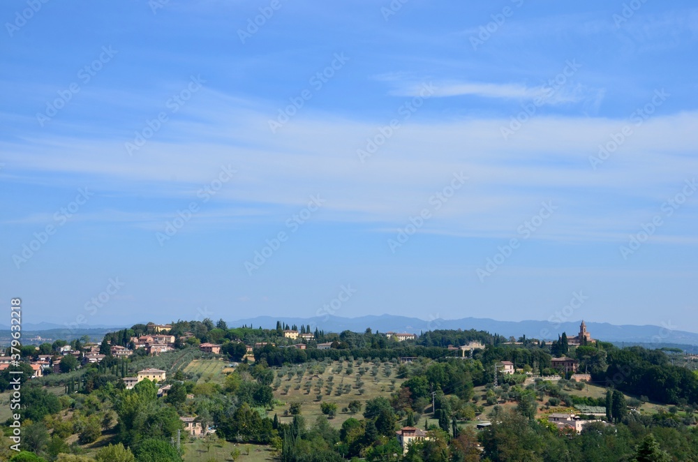 Countryside in Tuscany in autumn, Italy, view from the city wall of the town Siena, copy space