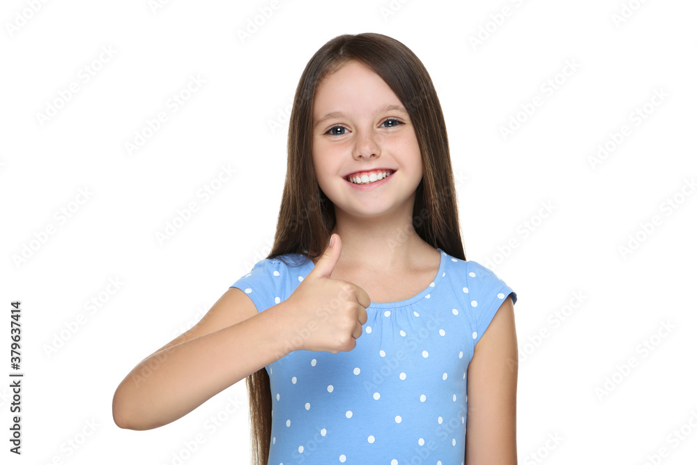 Young girl showing thumb up isolated on white background Young girl showing thumb up isolated on white background