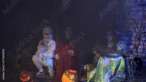 children in halloween costumes depict an orchestra