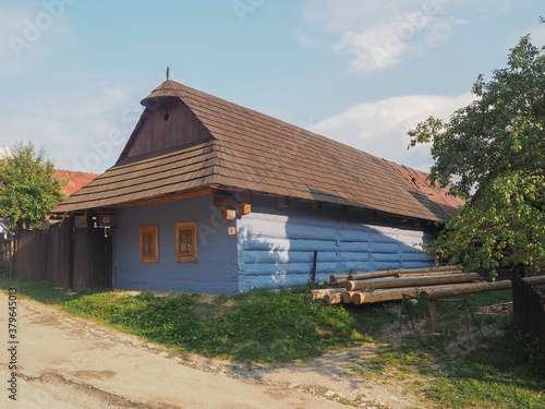 VLKOLINEC, SLOVAKIA, EUROPE, SUMMER 2015. Beautiful country house with traditional Slovak blue painted wooden architecture in the Unesco Heritage village of Vlkolinec.