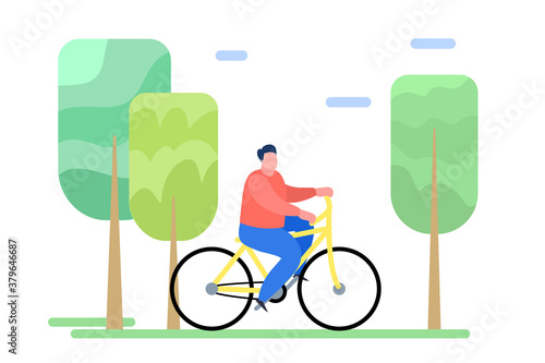 Man riding a bike in the park.