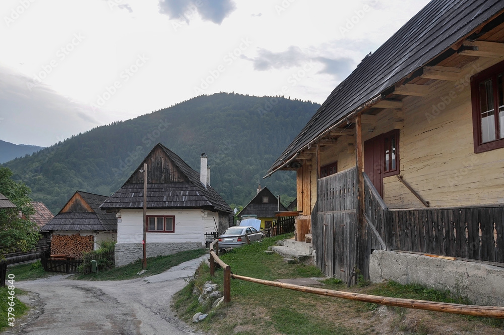 VLKOLINEC, SLOVAKIA, EUROPE, SUMMER 2015. Beautiful street in the center of Vlkolinec village, a Unesco heritage site. The houses are made of wood and painted in neutral colors.