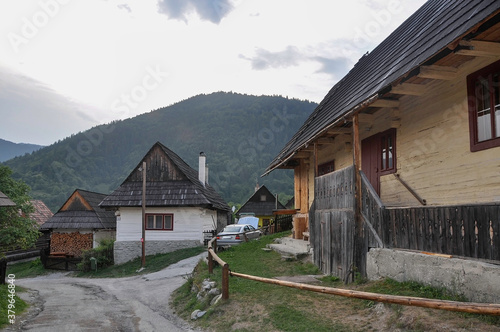 Obraz na płótnie VLKOLINEC, SLOVAKIA, EUROPE, SUMMER 2015. Beautiful street in the center of Vlkolinec village, a Unesco heritage site. The houses are made of wood and painted in neutral colors. w salonie