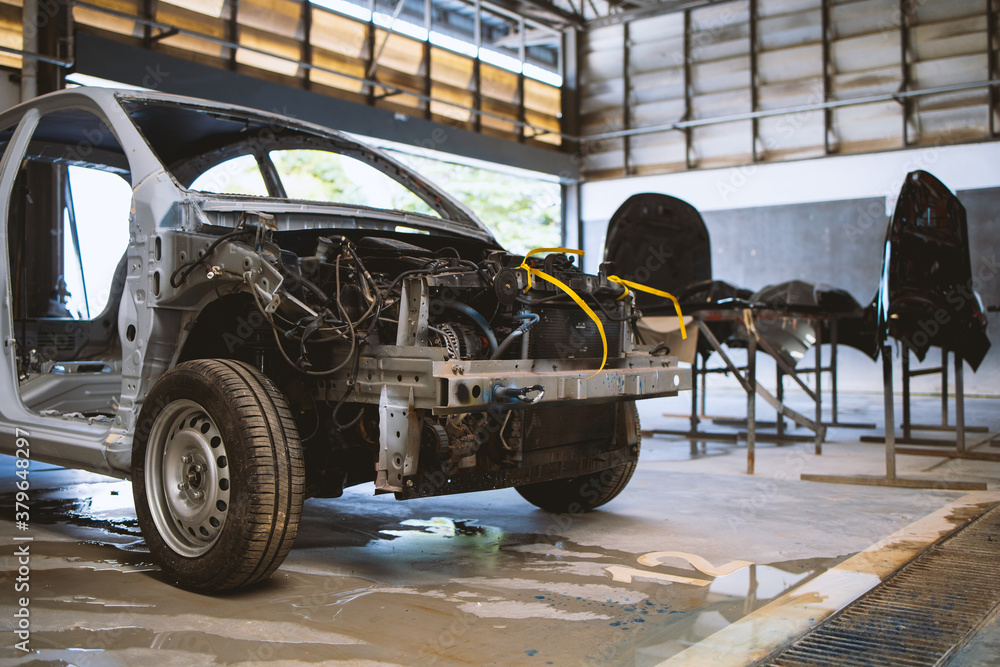 car in automobile repair service center with soft-focus and over light in the background car in automobile repair service center with soft-focus and over light in the background