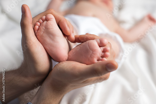 Baby foot in mothers hands