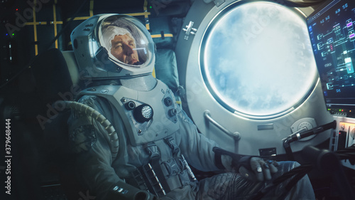 Astronaut Sitting Inside a Space Rocket During Take Off. Successful Rocket Launch Sending Space Ship into Space. Cosmonaut Experiencing G-Force and Vibrations Inside Capsule. Clouds in Porthole. photo