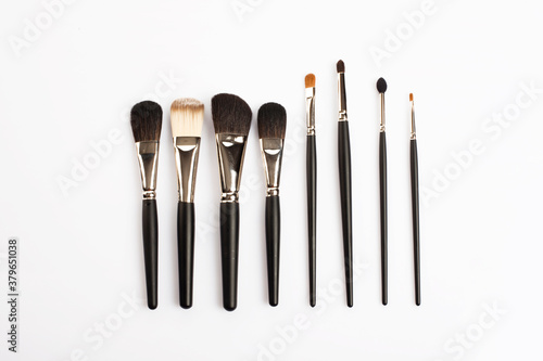 Various make up brushes on white background