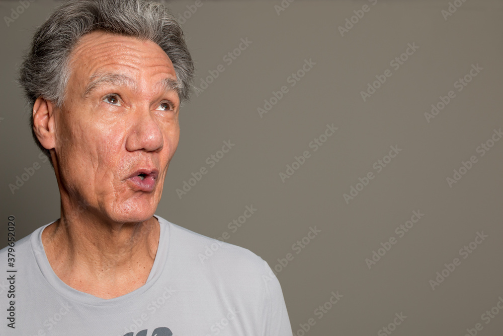 Portrait of a Senior Man having fun making faces and gestures Portrait of a Senior Man having fun making faces and gestures