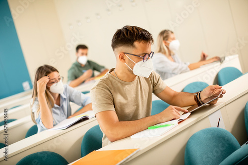 Male student wearing face p...