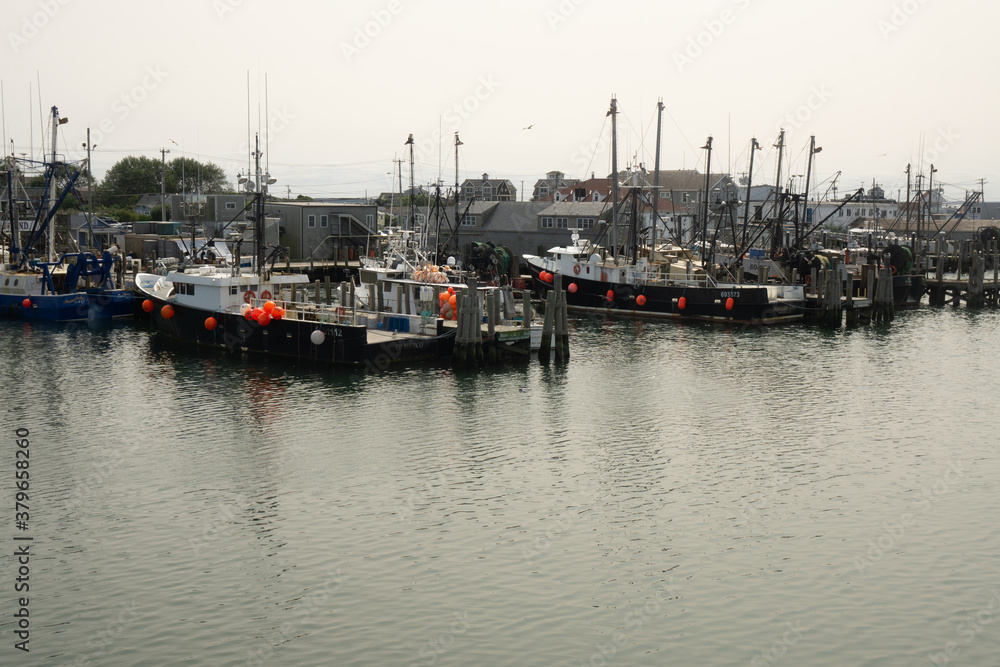Narragansett, RI / United States - Sept. 15, 2020: wide view of the pier and fishing boats of the Point Judith harbor in Rhode Island.