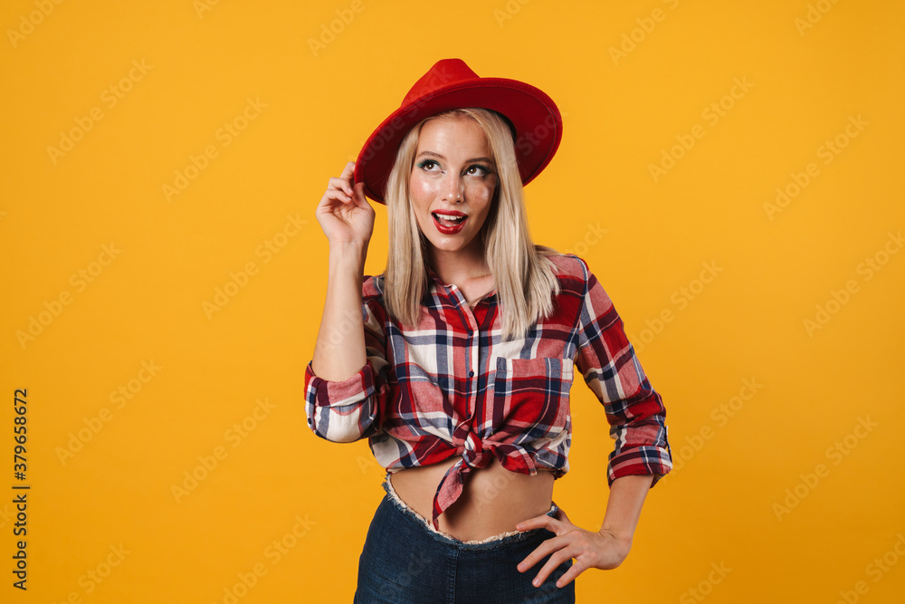 Image of pleased beautiful pinup girl posing in red hat Image of pleased beautiful pinup girl posing in red hat