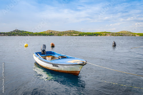 Wooden boat on a leash near the sea shore in Sibenik  Croatia