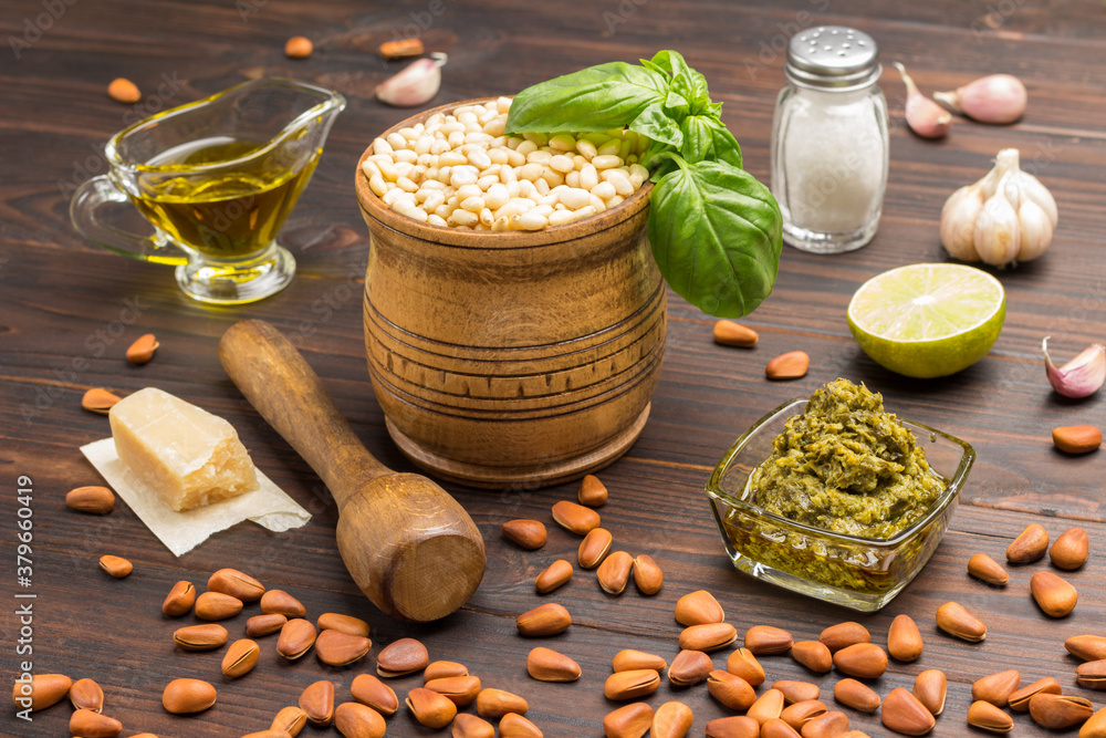 Ingredients for homemade pesto: basil leaves, parmesan, pine nuts