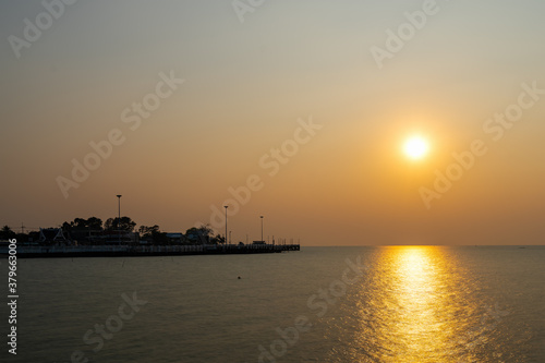 Beautiful seascape sunset with silhouette coast at thailand (long exposure)
