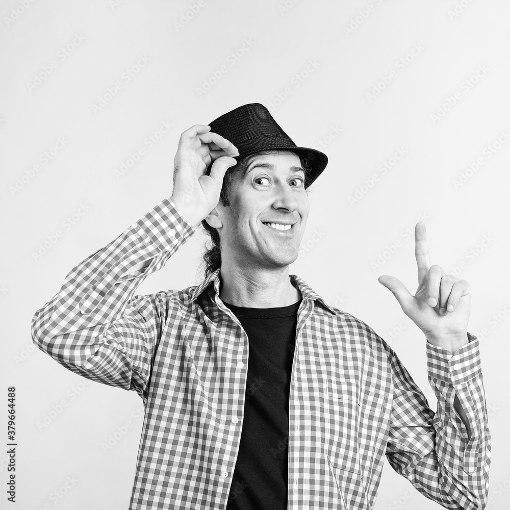 Happy man wears retro hat. Nerd smiling and looking to camera. Male fashion, lifestyle. Happy man wears retro hat. Nerd smiling and looking to camera. Male fashion, lifestyle.