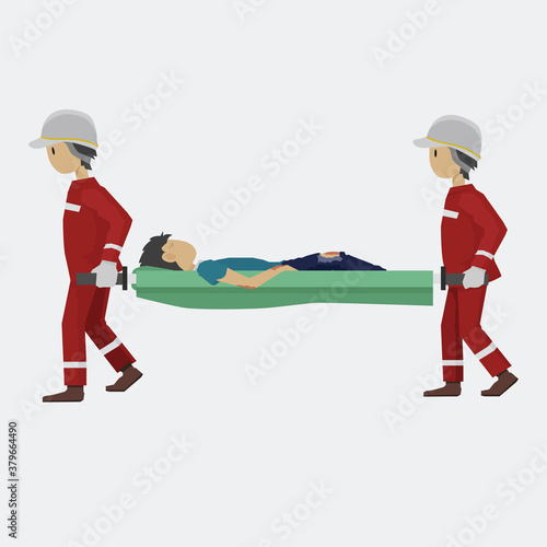 Two personnel helping people in an accident. By raising the injured person to a stretcher.