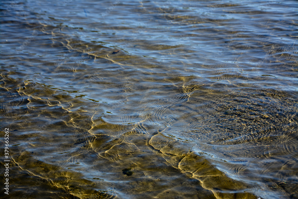 waves on the sand beach creating crocodile texture waves on the sand beach creating crocodile texture